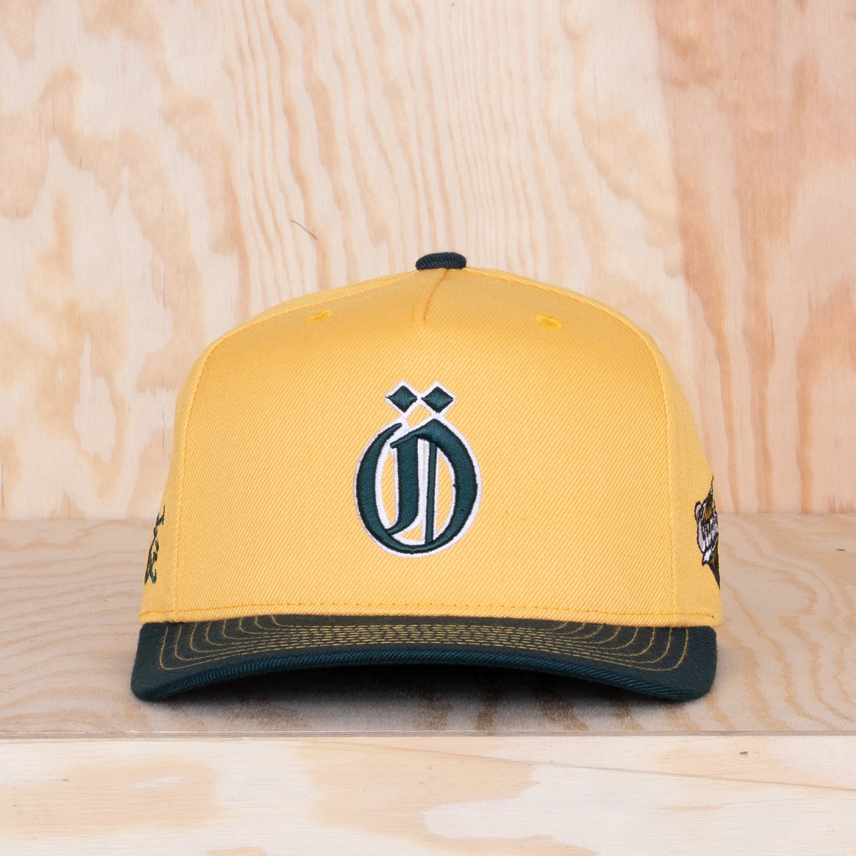 Ca'put Letter Ö Cap Gold / Dark Forest